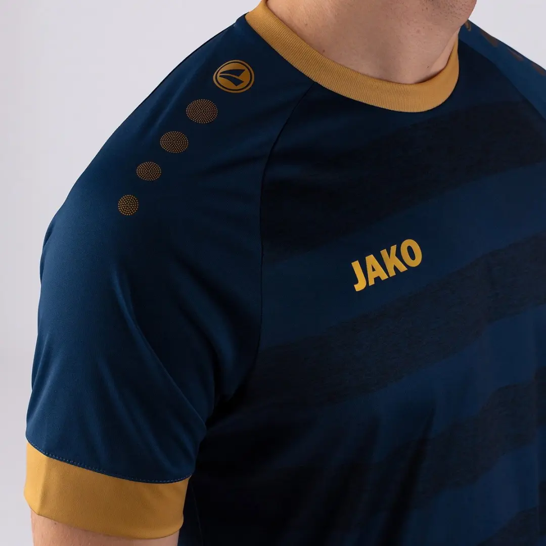 JAKO Celtic Melange Shirt Heren XXL - Goud/Navy