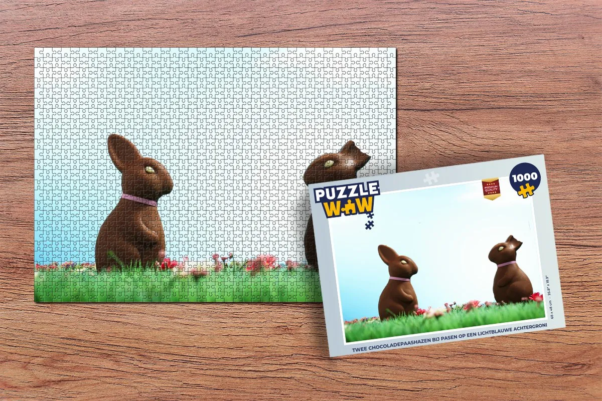 Puzzel Twee chocoladepaashazen bij Pasen op een lichtblauwe achtergrond - Legpuzzel - Puzzel 1000 stukjes volwassenen