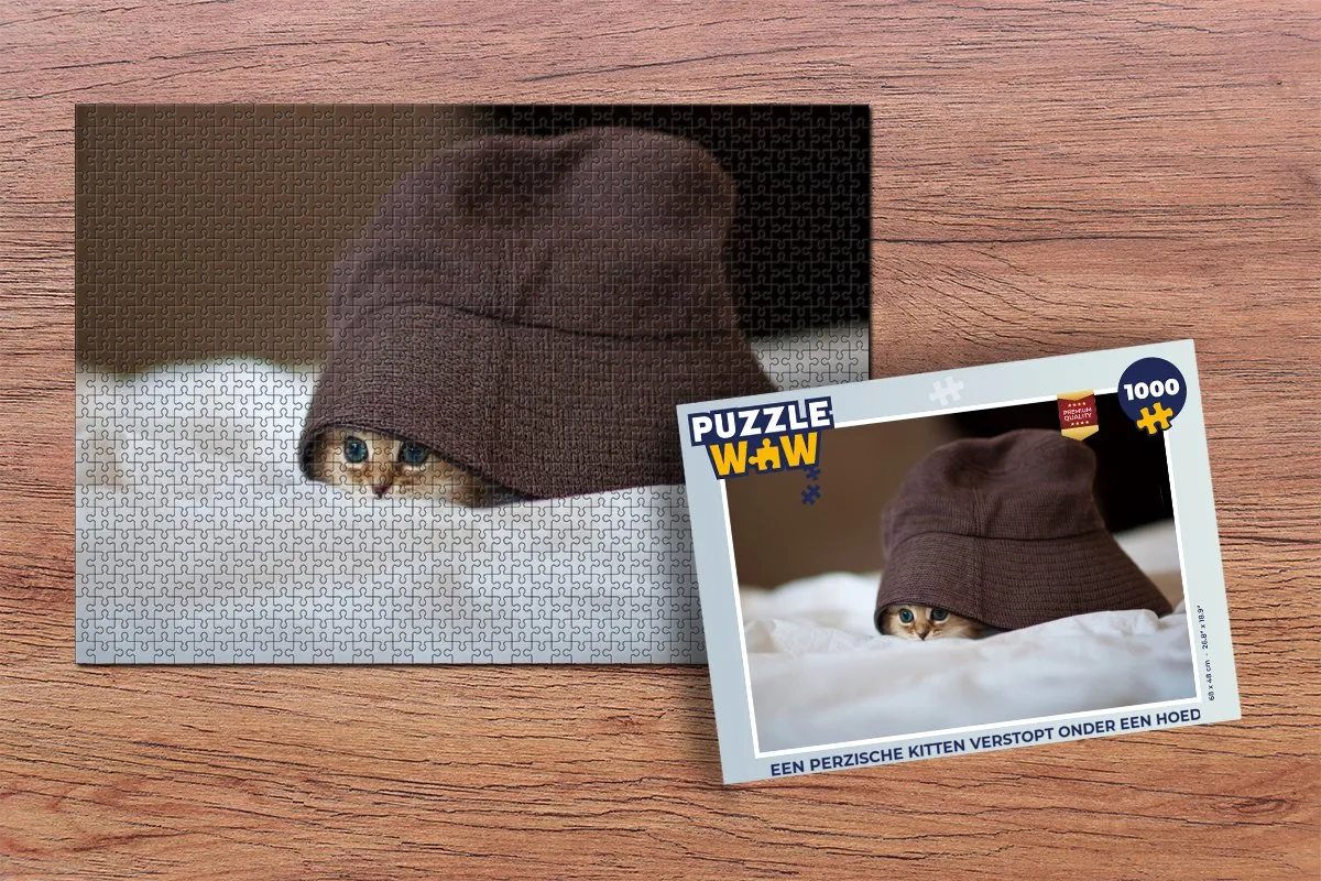 PuzzleWow Legpuzzel Een Perzische kitten onder een hoed - 1000 Stuks - Multicolor