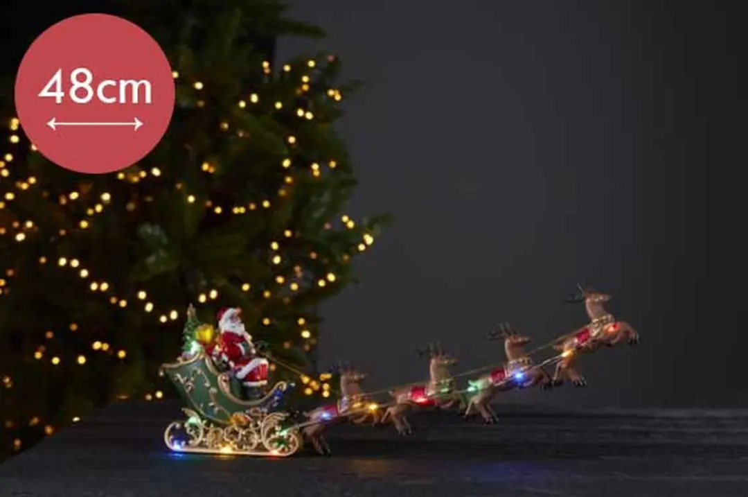 Kerstman in Arreslee verlicht