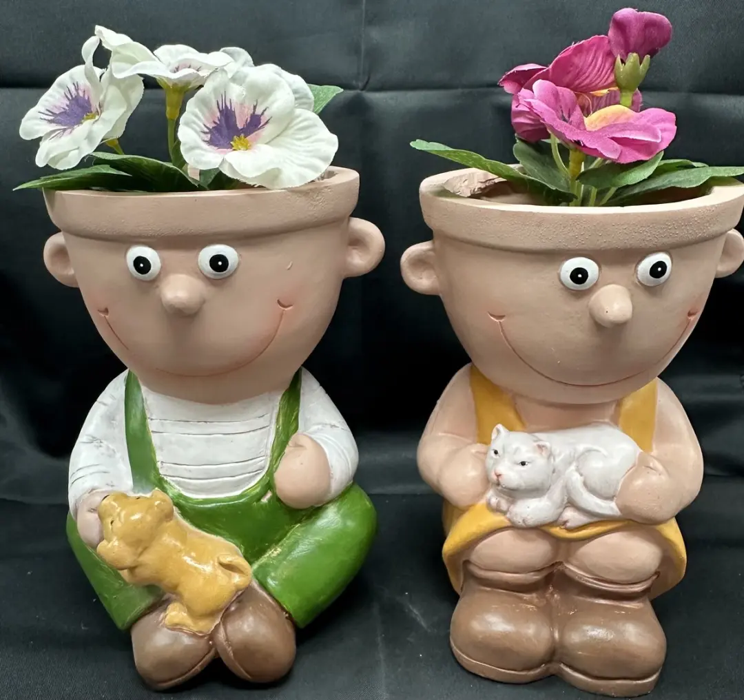 Decoratieve bloempotten "Jongen en Meisje" van polyresin