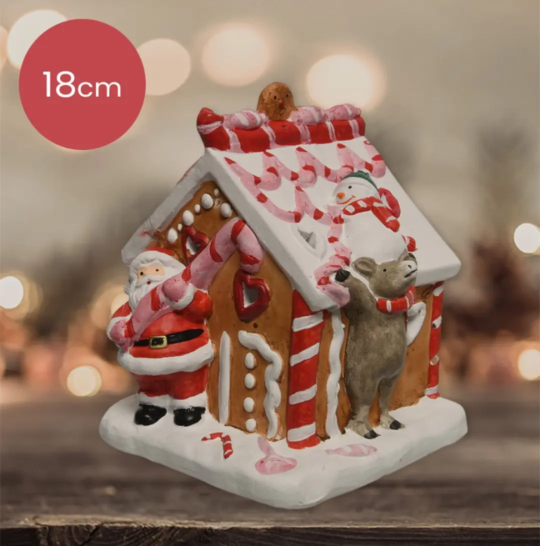Terracotta kersthuisje met snoep en kerstman