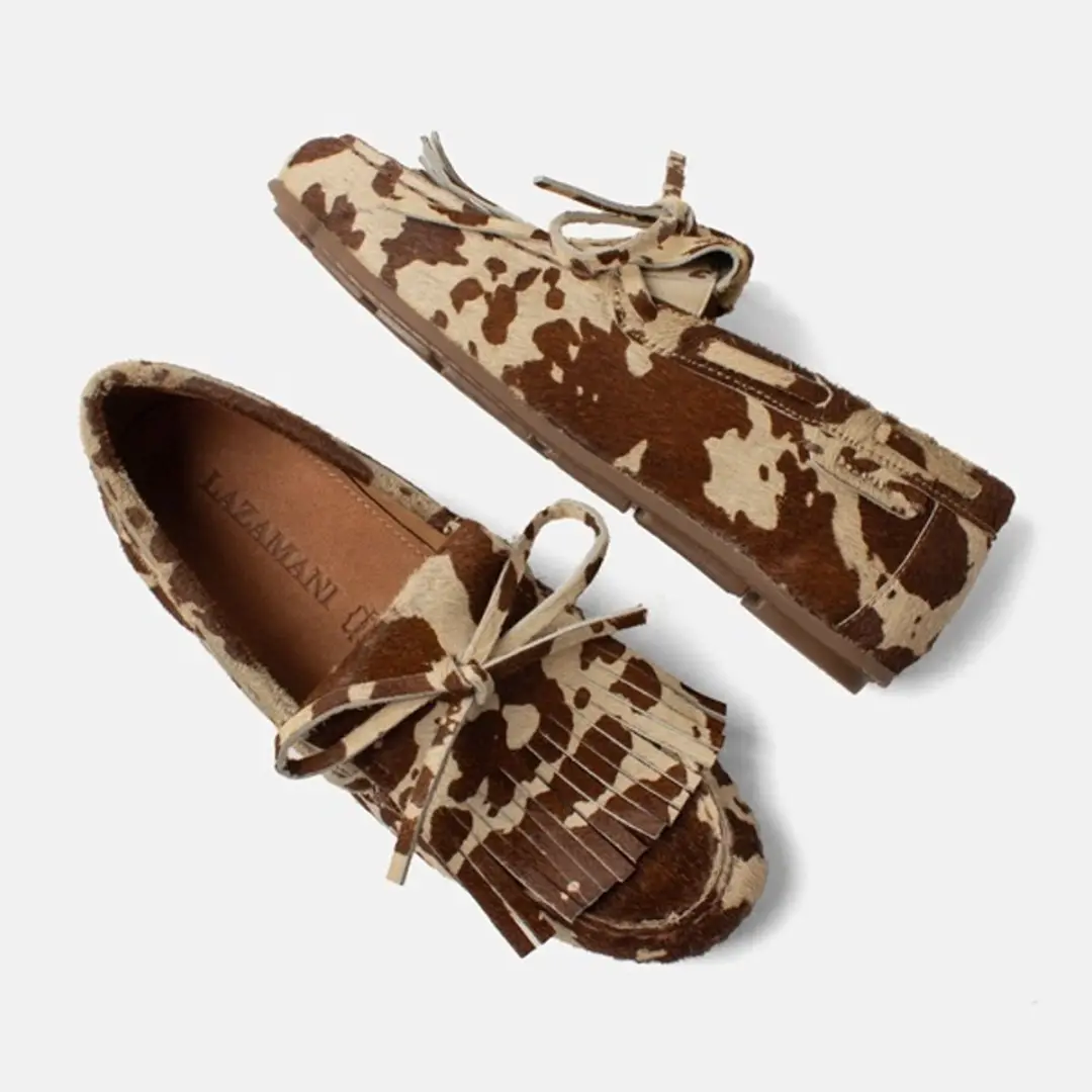 Lazamani hairy leren loafers met koeienprint