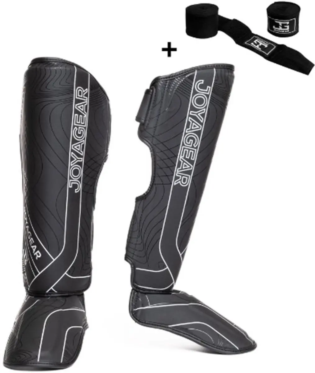 Joya ESSENTIAL Scheenbeschermers – Maat S – Zwart/Wit – Kickboksen/Muay Thai/MMA – Ergonomische pasvorm, schokabsorberende padding – Inclusief Bandage