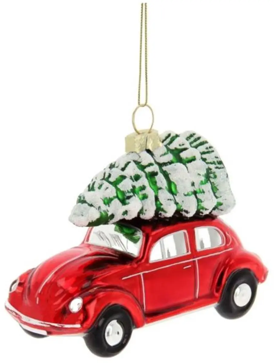 Volkswagen Rode Beetle met Boom