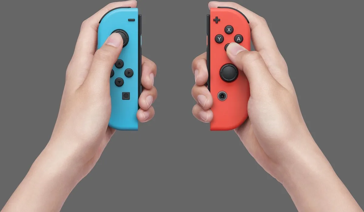 Nintendo Switch OLED Blauw/Rood - 64GB - afbeelding 6 van 6