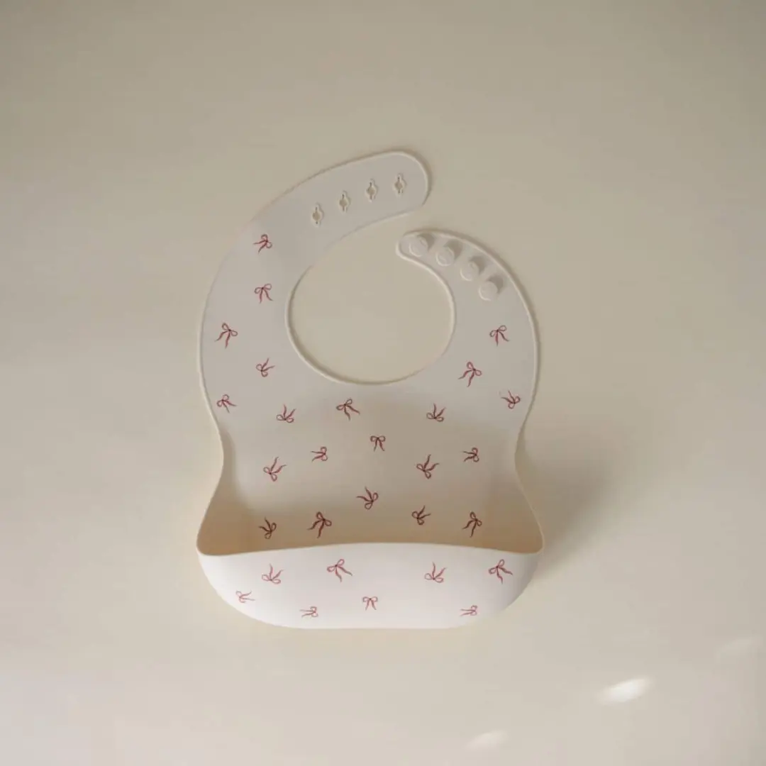 Mushie Siliconen Slabbetje Bows - Crème