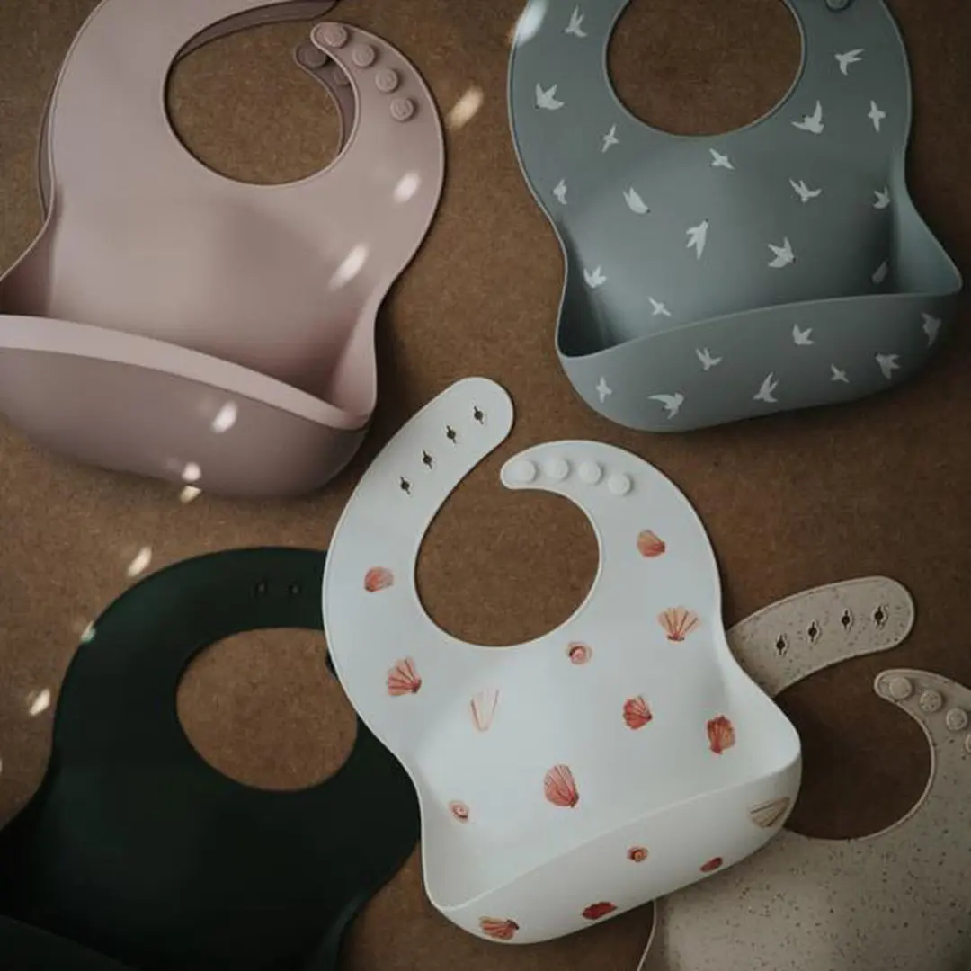 Mushie Siliconen Baby Slabbetje Dino - BPA/ftalaatvrij