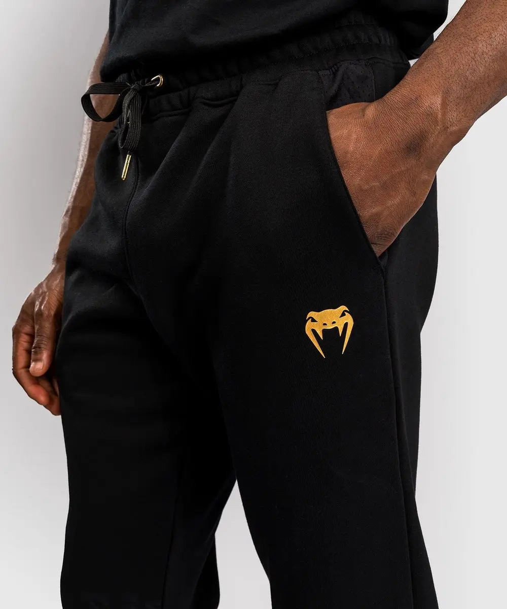 UFC Venum Replica Trainingsbroek Champion - M - Zwart/Goud