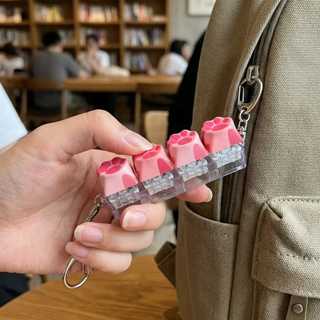 NUVEX Roze Kattenpoot Fidget Toy - Klikknoppen - Met Clip