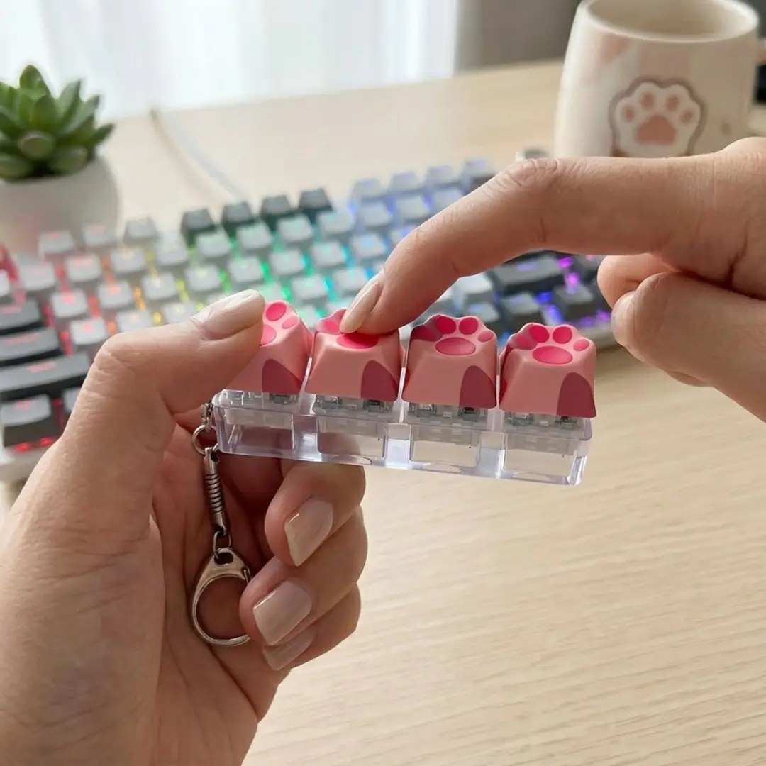 NUVEX Roze Kattenpoot Fidget Toy - Klikknoppen - Met Clip