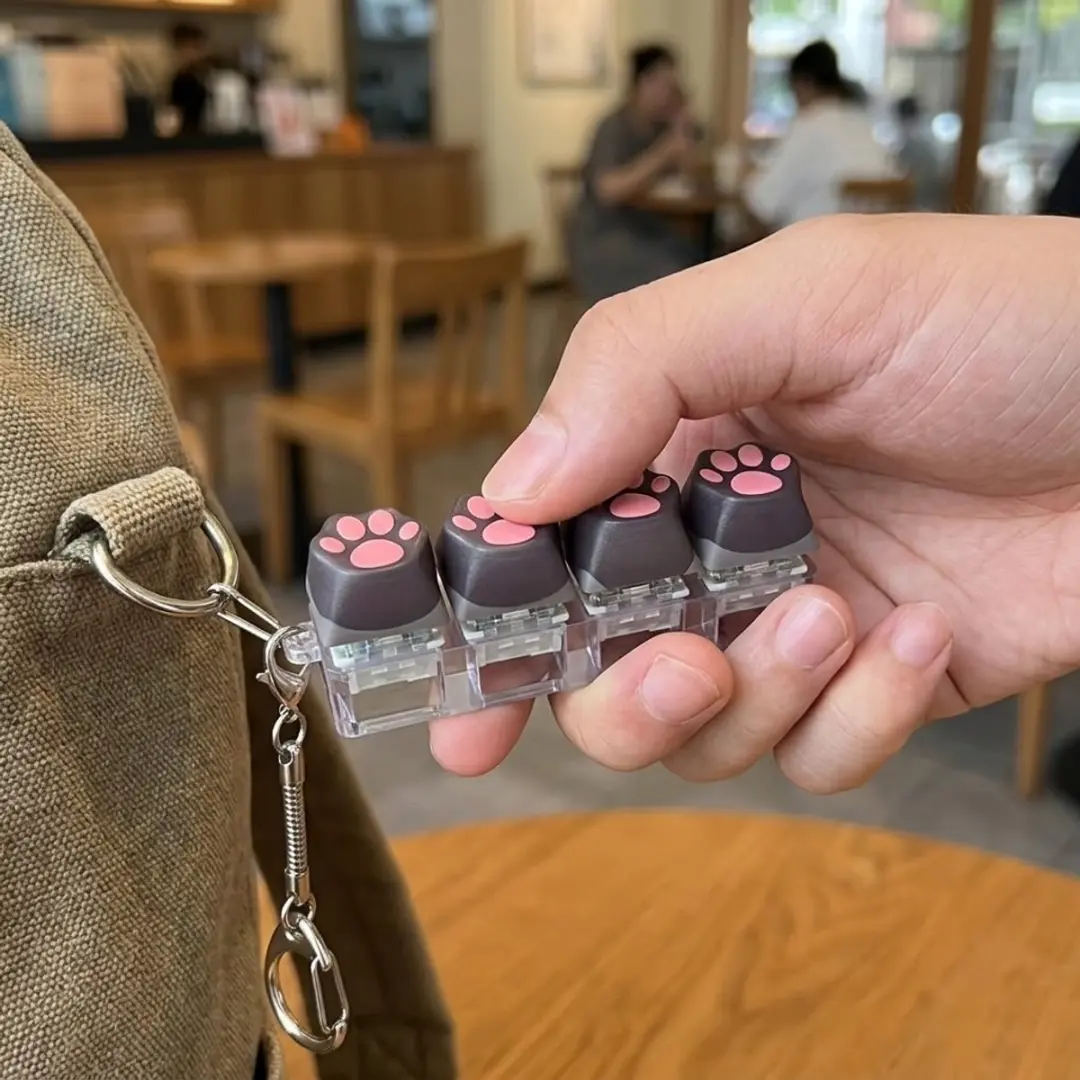 NUVEX Zwart Kattenpoot Fidget Toy - Kliktoetsen